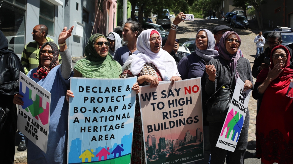 Bo Kaap residents protest in the streets [Erica Jenkin/Al Jazeera]
