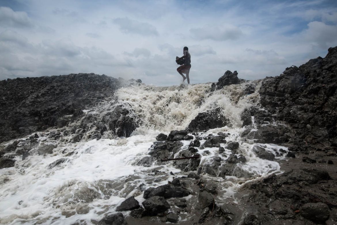 Mojid, 55, trying to repair the riverbank just cyclone Fani hits in the coastal area of Khulna District. He said that he has lost his house 4 times during he taking care of his family and he is witnes
