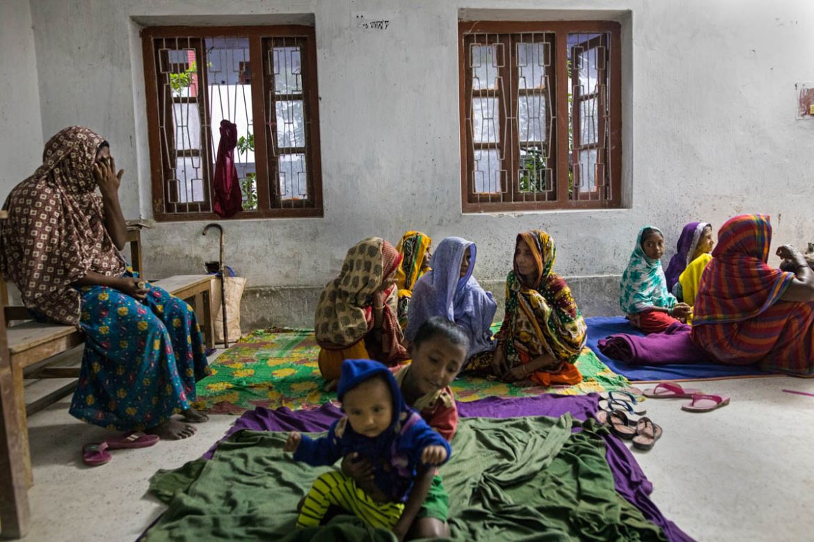 Coastal people take shelter in a cyclone center before cyclone Bulbul hits in Dacope area of Khulna District. Many people didn''t take shelter because they are used to with storm and they depended on G
