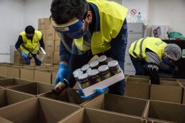 Lebanese Food Bank staff pack boxes distributed to needy families during the struggling country's economic crisis [Courtesy: Lebanese Food Bank]