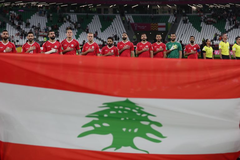 Soccer Football - Arab Cup - Group D - Lebanon v Sudan - Education City Stadium, Al Rayyan, Qatar - December 7, 2021 Lebanon players line up during the national anthems before the match REUTERS/Suhaib Salem