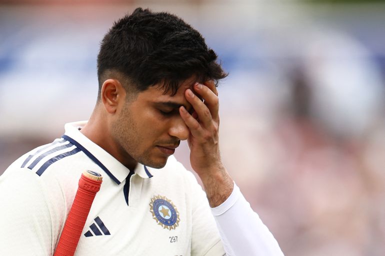 India's captain Shubman Gill leaves the field after being run out on the first day of the fifth Test cricket match between England and India