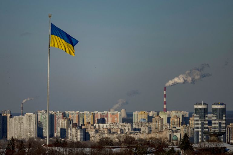 The Ukrainian national flag flies over the city, amid Russia’s attack on Ukraine, in central Kyiv, Ukraine, February 17, 2025. REUTERS/Thomas Peter
