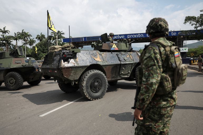 A soldier stands near military vehicles at the border between Venezuela and Colombia in Cucuta, Colombia