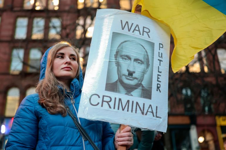 GLASGOW, SCOTLAND - FEBRUARY 24: Members of the public gather in St Enoch Square to mark the fourth anniversary of the Russian invasion of Ukraine on February 24, 2026 in Glasgow, Scotland. Demonstrations in solidarity with Ukraine are taking place around the world, as Ukraine prepares to mark the grim milestone of four years at war, following the launch of Russia's full-scale invasion on February 24, 2022. (Photo by Jeff J Mitchell/Getty Images)