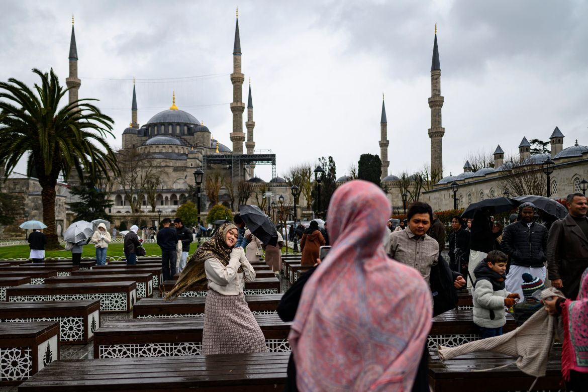 Muslim devotees attend the morning prayers celebrating the holiday of Eid al-Fitr, marking the end of the holy month of Ramadan, at the Blue Mosque, in Istanbul, on March 20, 2026. (Photo by Yasin AKGUL / AFP)