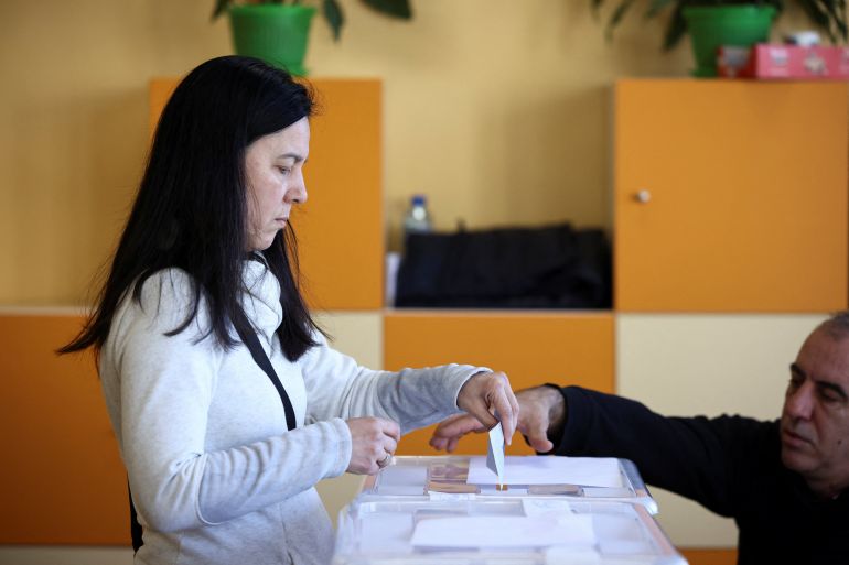 A woman votes during the parliamentary election, in Sofia, Bulgaria