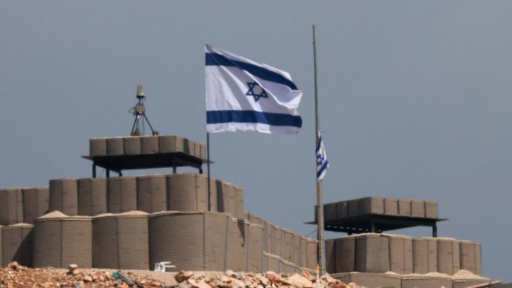 An Israeli flag flutters at a military base in Lebanon, near the Israel-Lebanon border.